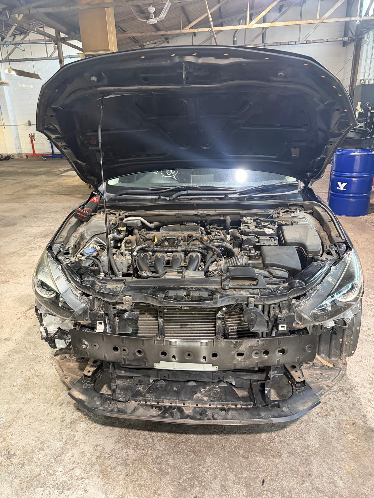Front end repair with engine bay exposed